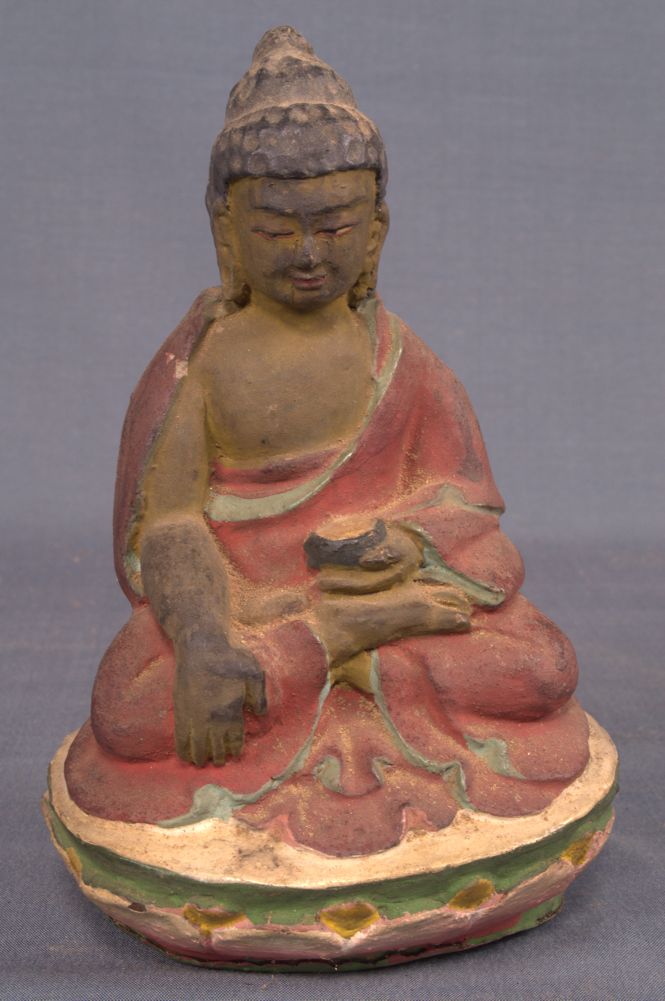 An old bhutanese clay statue probably depicting the Buddha